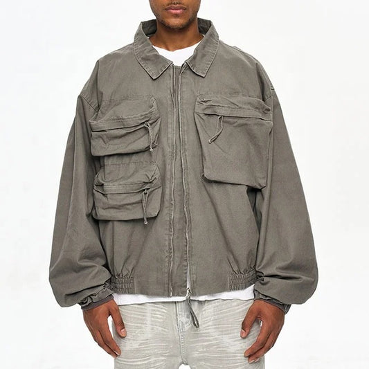 Veste grise avec poches multiples et fermeture zippée