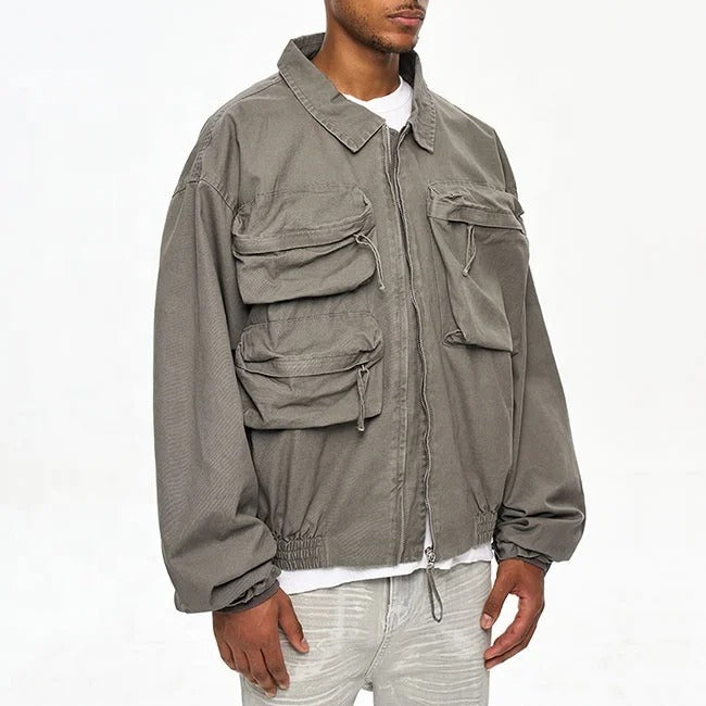 Veste grise avec poches multiples et fermeture zippée
