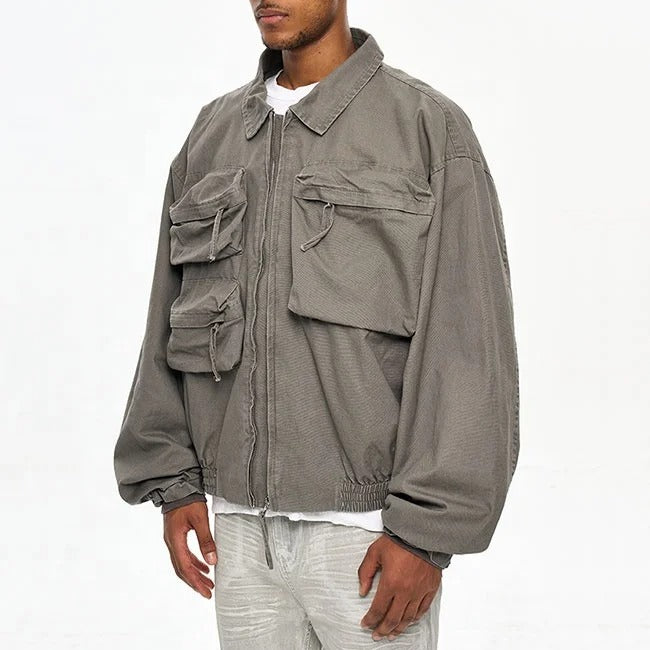 Veste grise avec poches multiples et fermeture zippée