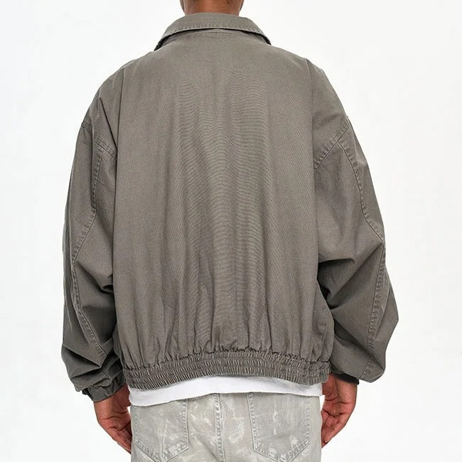 Veste grise avec poches multiples et fermeture zippée