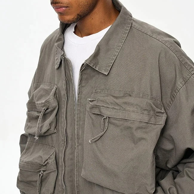 Veste grise avec poches multiples et fermeture zippée